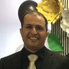 Portrait of Almabrok Essa, Assistant Professor at John Carroll University
