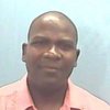 Portrait of Ficawoyi Donou-Adonsou, Associate Professor at John Carroll University