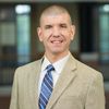 Portrait of Nathan Jun, Visiting Asst. Professor at John Carroll University