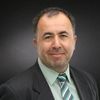 Portrait of Saban Adana, Associate Professor at John Carroll University