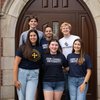 Six Young Adults Smile Standing Closely Together Front