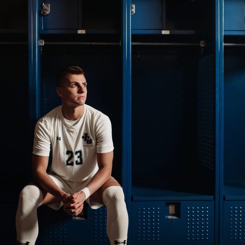 Soccer Player White Uniform Blue Lockers