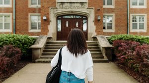 Student White Sweater Denim Skirt Brick Building