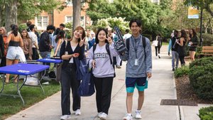 Three Students Campus Path Peace Signs