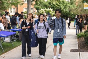 Three Students Campus Path Peace Signs